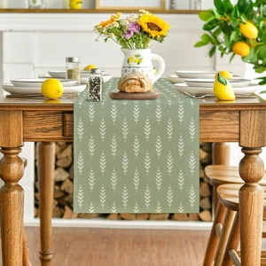 Detailed texture of Morandi green table runner with white geometric wheat patterns