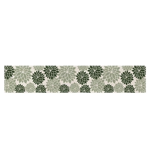 Green geometric floral table runner with natural linen texture for dining decor