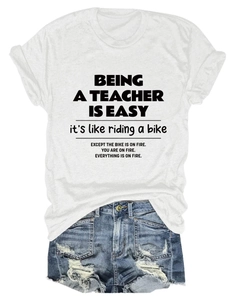 Detail of rolled sleeve cuffs and slogan print on a white cotton crew neck t-shirt
