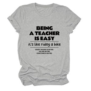 Detail of grey crewneck T-shirt with teacher slogan and rolled cuffs in soft cotton blend