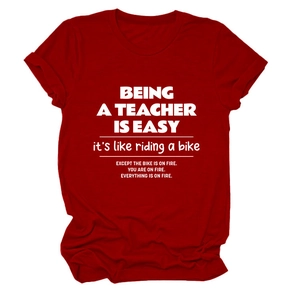 Detail of dark red cotton T-shirt featuring white Being A Teacher Is Easy slogan print