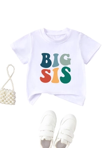 Detailed view of white cotton T-shirt featuring colorful BIG SIS print and crew neck