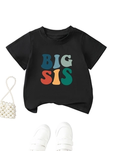 Detail of black cotton kids T-shirt featuring colorful Big Sis lettering and accessories
