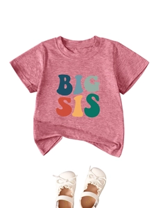 Detail of pink cotton Big Sis t-shirt paired with white bow sandals for girls