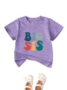 Flat lay of purple cotton Big Sis T-shirt with colorful letters and white Mary Jane shoes