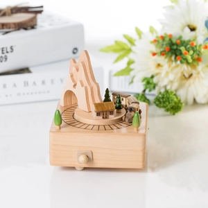 Wooden music box with mountain and train scene, a natural wood craft holiday gift