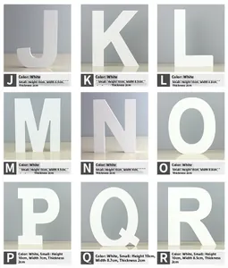 Detail of white wooden wall letters J to R with matte finish for home decor