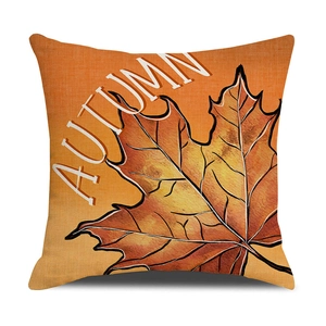 Autumn pumpkin pillow cover with maple leaf print and artistic 'AUTUMN' typography