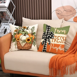 Fall decorative pillow covers with pumpkin and sunflower designs on a cozy beige sofa