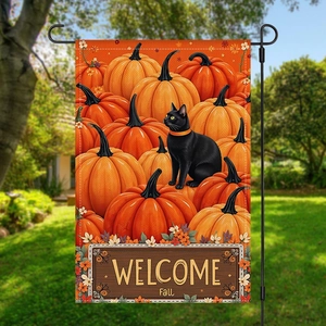 Outdoor garden flag detail showing black cat with pumpkins and Welcome Fall text