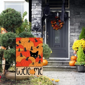 Black cat with pumpkins double sided Halloween garden flag displayed on house porch