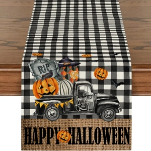 Detail eines Halloween-Tischläufers aus Leinen mit Kürbis-LKW, Grabstein und Spinnennetz