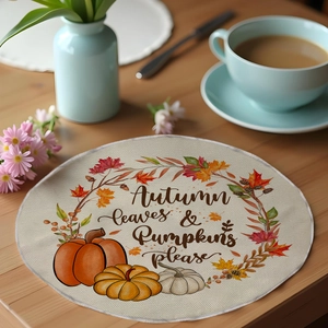 Detail of round linen placemat with Autumn Leaves & Pumpkins Please seasonal print