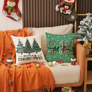 Christmas linen pillow covers with pine tree prints and snow lettering for home decor