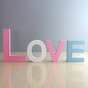 White and pink wooden LOVE letters for creative wall decoration and photo props