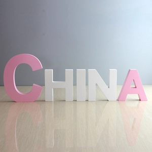 Pink and white wooden letters spelling CHINA for creative home wall decor
