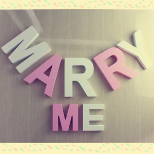 Pink and white wooden 3D letters spelling MARRY ME for wedding proposal decorations