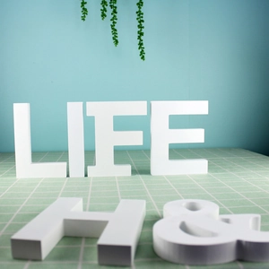 White 3D wooden letters LIFE and & symbol for creative DIY wall decor and home styling