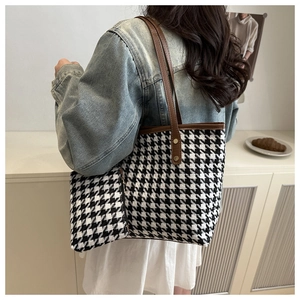 French retro houndstooth tote bag and matching pouch shown in a cozy indoor setting