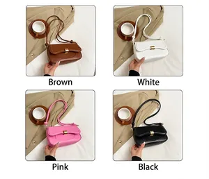 Detail view of stylish square shoulder bags in brown, white, pink, and black with metal buckles