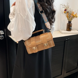 Vintage brown leather Boston bag with retro stitching and ethnic style wide strap