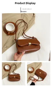 Detailed close-up of brown faux leather shoulder bag with elegant gold metal snap button