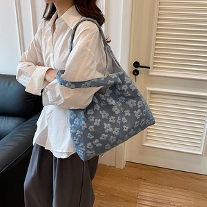 Minimalist blue floral canvas tote bag for women showing spacious textured design