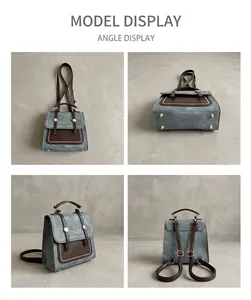 Detail view showing gray denim bag with leather trim and gold protective bottom studs