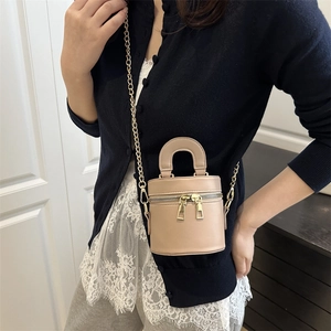 Mini khaki cylindrical shoulder bag with gold chain and double zipper in minimalist style