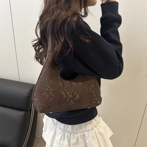 Brown snakeskin shoulder tote bag with elegant animal texture and a crescent shape