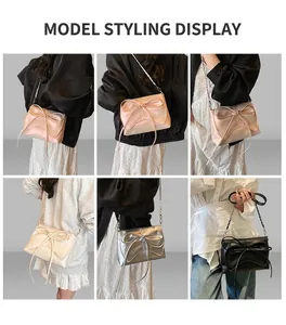 Detail of sweet bow crossbody bag with metal chain strap shown on model in four colors