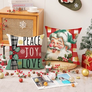 Christmas snowman pillows with PEACE JOY LOVE lettering and red checkered Santa Claus design