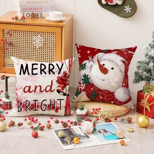 Set of linen Christmas pillow covers with snowman print and festive slogans for decor