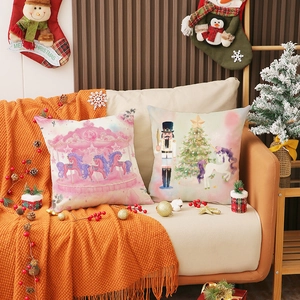 Christmas nutcracker and pink carousel linen pillow covers on a cozy sofa setting