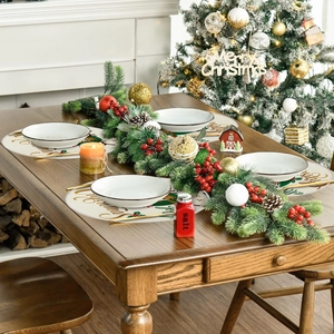 Christmas round linen placemat with Merry Christmas text and red holly berry pattern