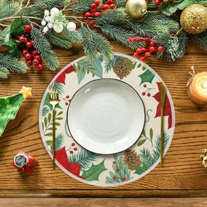Detailed close-up of a Christmas linen placemat with pine cones and red berries on a table