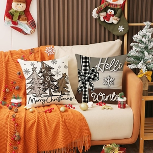 Linen Christmas pillow covers with Merry Christmas tree and Hello Winter prints on sofa