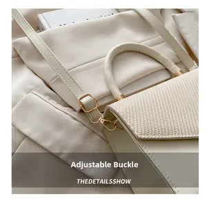 Detail show of adjustable metal buckle on cream patchwork leather and woven crossbody bag