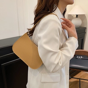 Minimalist ginger leather baguette shoulder bag with lychee texture for modern women