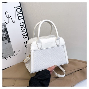 Detail of white PU shell bag with woven fabric and FASHION & BAGS logo embossing