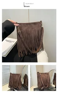 Detailed view of brown fringe shoulder bag featuring premium matte suede texture