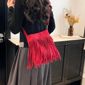 Vintage red suede tassel crossbody bag for women with bohemian fringe and spacious design