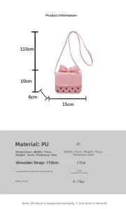 Pink crossbody bag with black polka dots and size measurements shown in centimeters