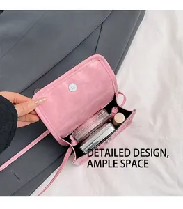 Pink mini crossbody bag interior showing space for lipstick and makeup compact