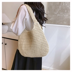 Detail of the dense crochet handwoven texture on this large beige straw tote beach bag