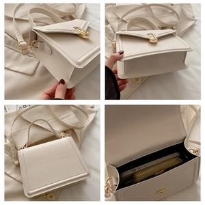 Detailweergave van beige schoudertas interieur, gouden gesp en getextureerde lederen finish