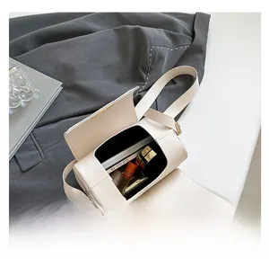 Internal view showing the large storage capacity of the cream vintage box crossbody bag