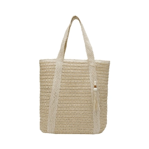 Summer woven straw tote bag with tassel charm and hollow-out texture on white background