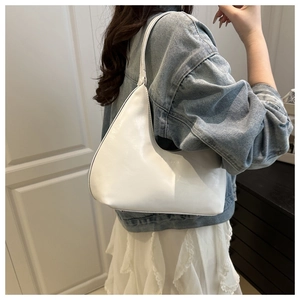 Detailed side view of white leather hobo bag with embossed FASHION text for women