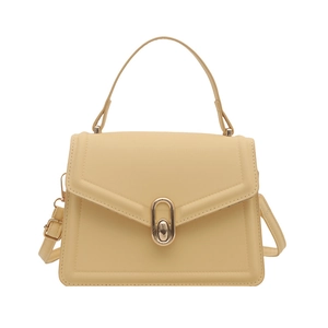 Minimalist beige crossbody handbag with top handle and gold metal twist lock